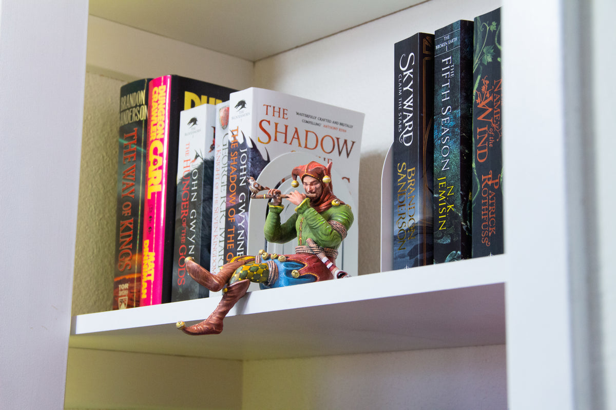 Bookshelf Court Jester playing a flute