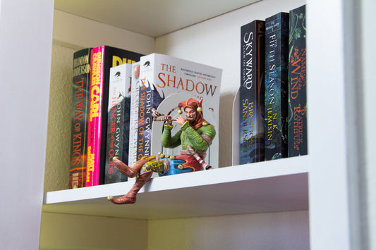 Bookshelf Court Jester playing a flute