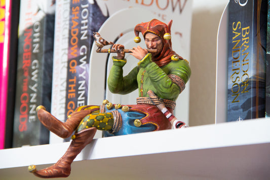 Bookshelf Court Jester playing a flute