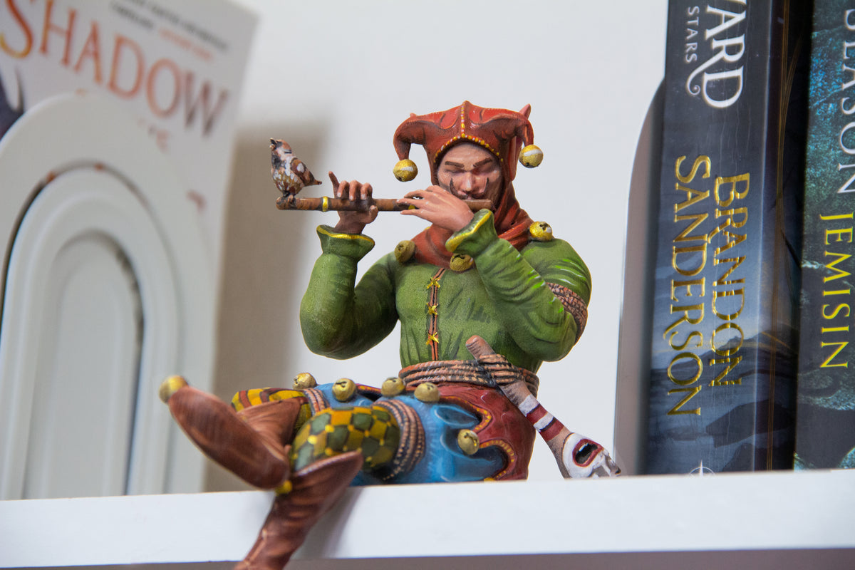Bookshelf Court Jester playing a flute