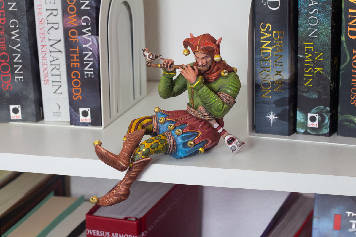 Bookshelf Court Jester playing a flute