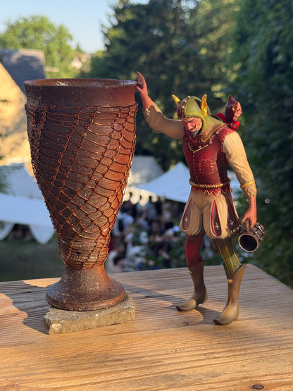 Boozy Bookshelf Court Jester holding a jug