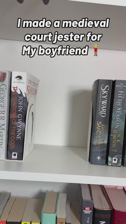 Bookshelf Court Jester playing a flute